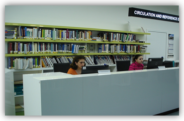 A picture of the Circulation and Reference Desk at the library entrance